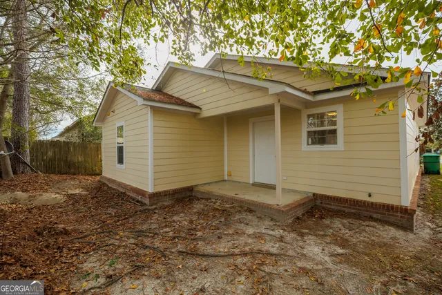 a backyard of a house with lots of green space