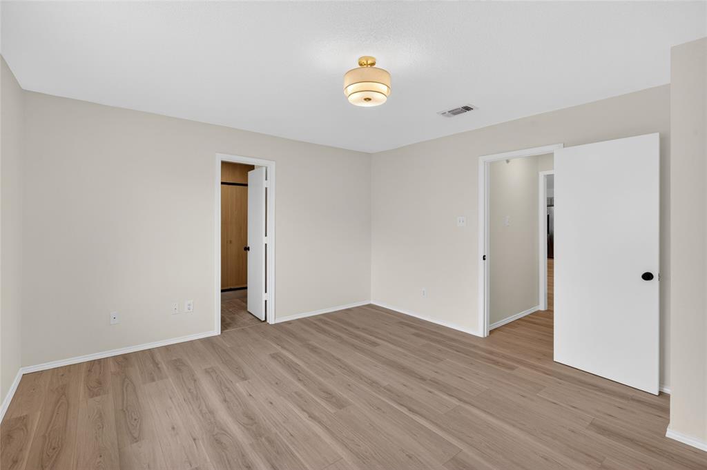 509 Brookside Court Burleson, TX 76028 - Photo 8 of 18 a view of an empty room and wooden floor