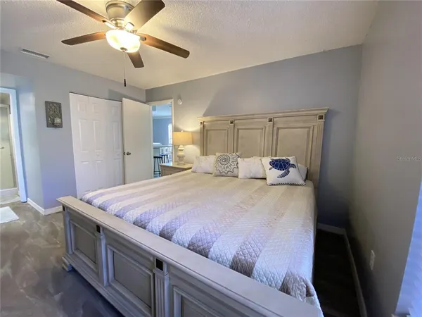 a bed room with a bed and a chandelier