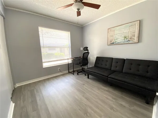 a living room with furniture and a window