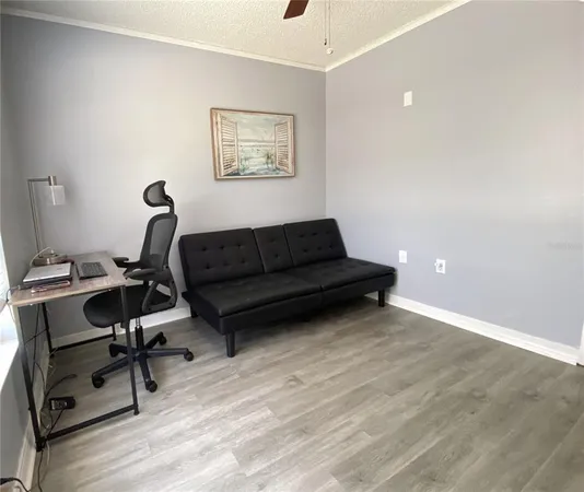 a view of workspace with wooden floor windows