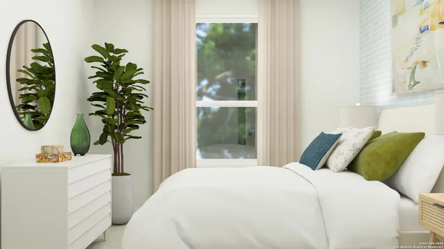 a bedroom with a bed a mirror and a window