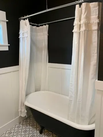 a bathroom with a shower and a tub