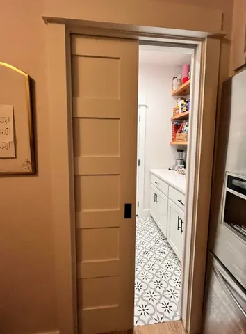 a bathroom with a shower and a sink