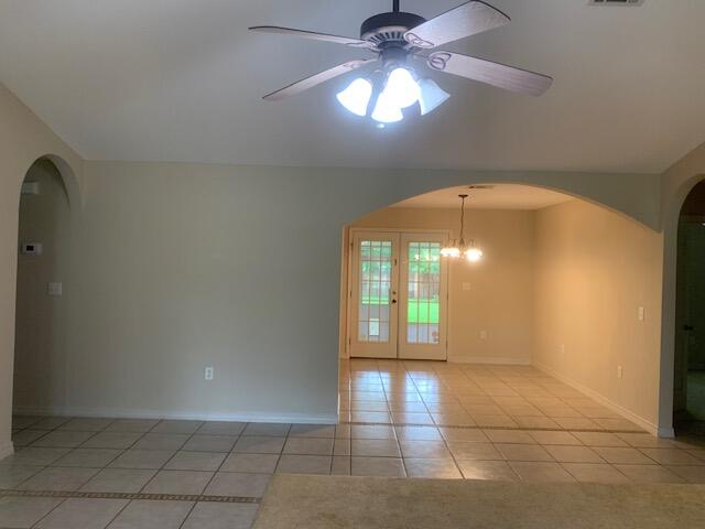 6444 Kylito Circle Crestview, FL 32539 - Photo 5 of 23 wooden floor in an empty room with a window