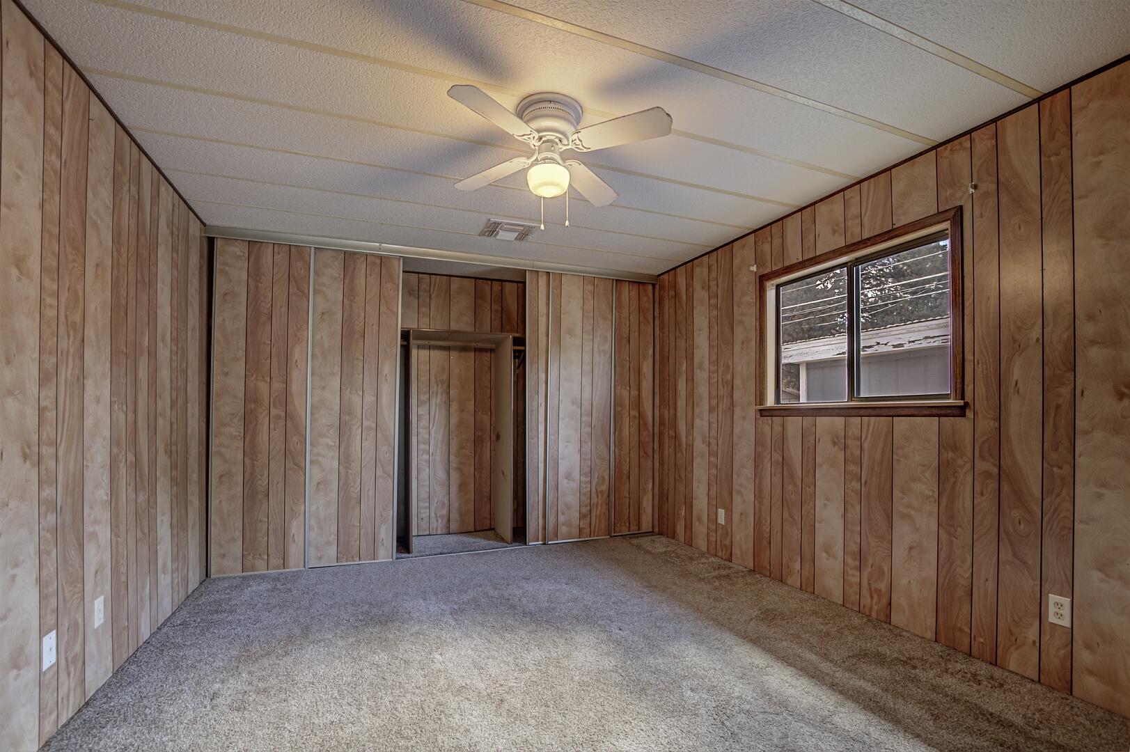411 West Bridle Path Lane Payson, AZ 85541 - Photo 7 of 21 an empty room with closet and windows