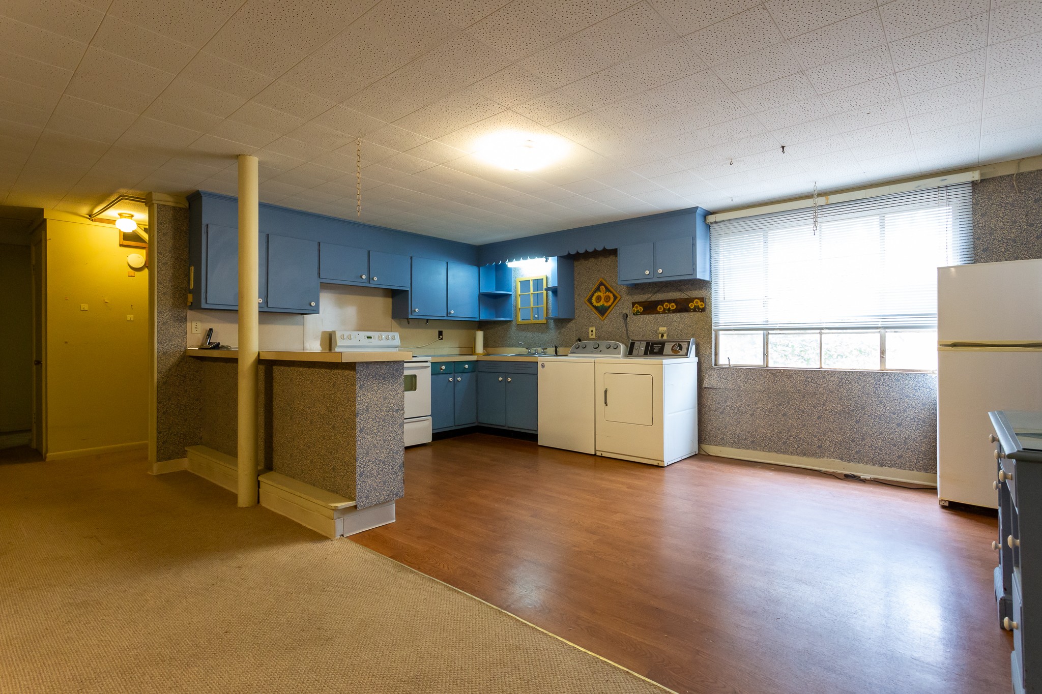 133 Byrd Road Dover, TN 37058 - Photo 15 of 35 a kitchen with a refrigerator a stove top oven a sink and a window