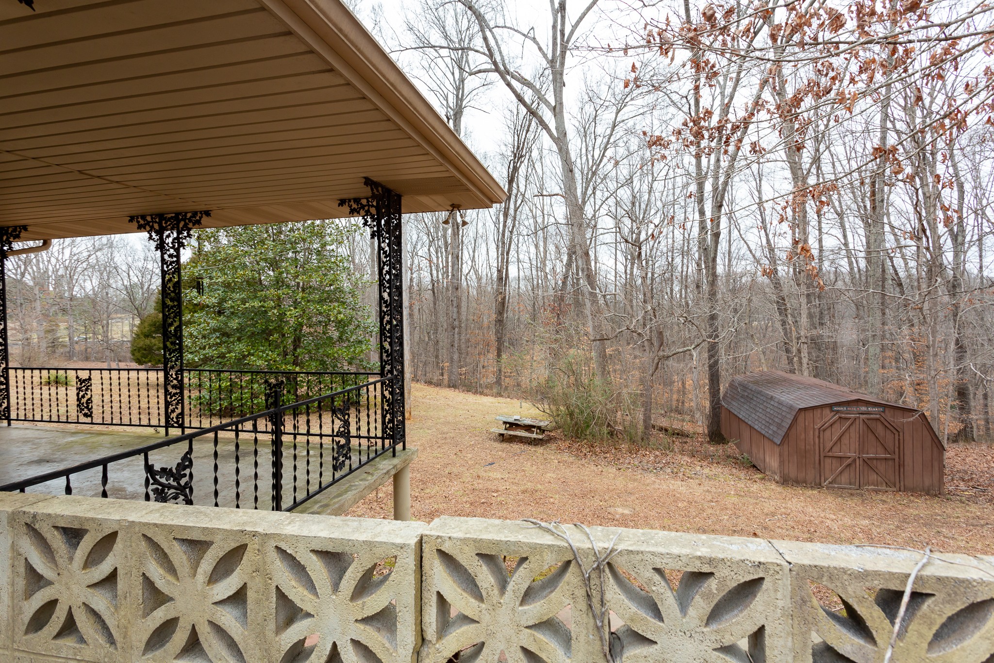 133 Byrd Road Dover, TN 37058 - Photo 27 of 35 a backyard of a house with table and chairs