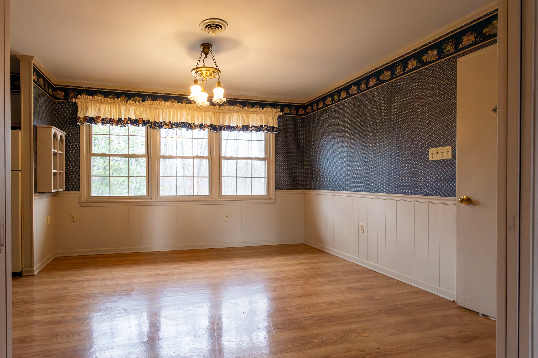 133 Byrd Road Dover, TN 37058 - Photo 4 of 35 a view of an empty room with wooden floor and a window