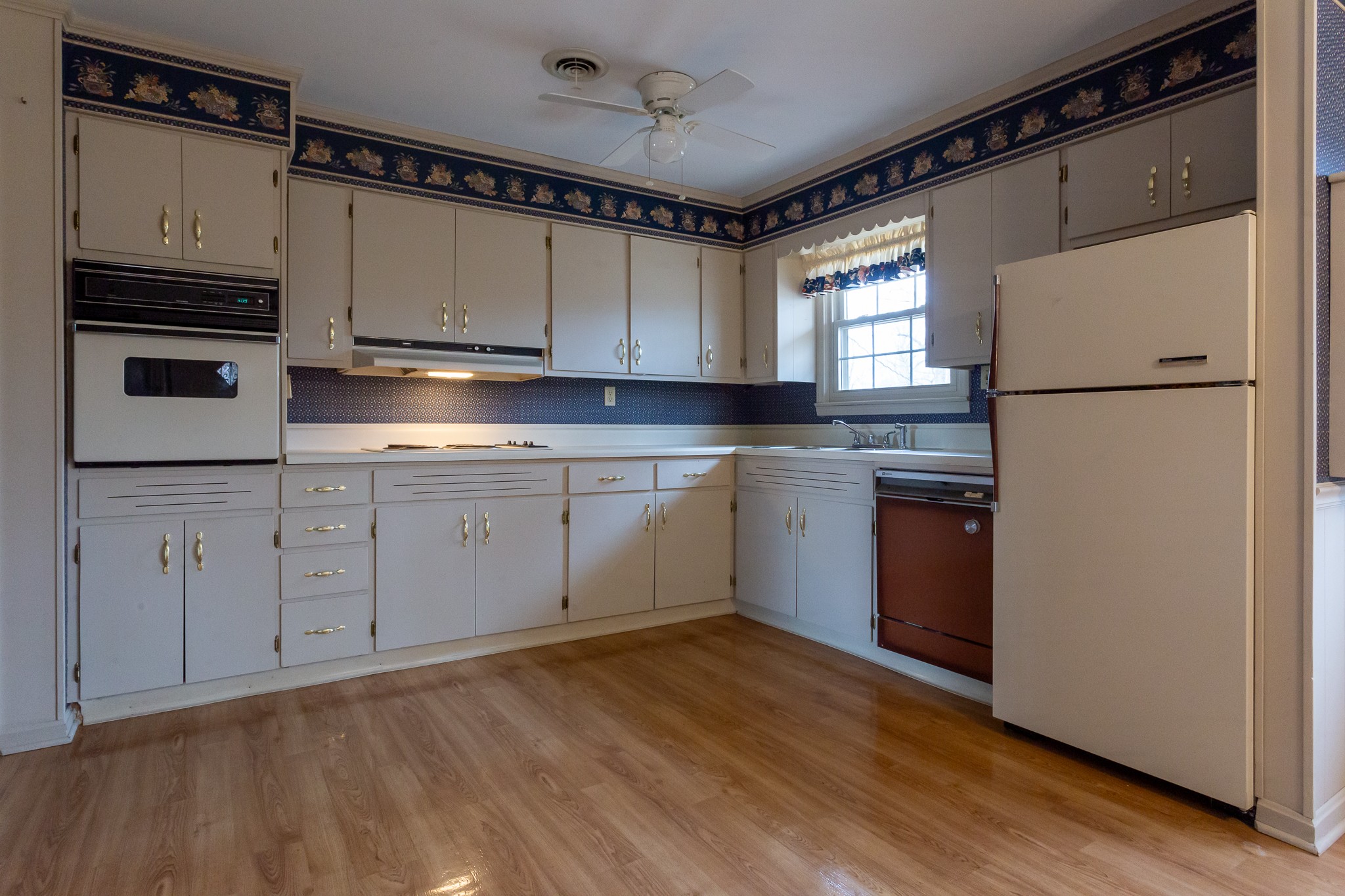 133 Byrd Road Dover, TN 37058 - Photo 6 of 35 a kitchen with cabinets appliances a sink and a window