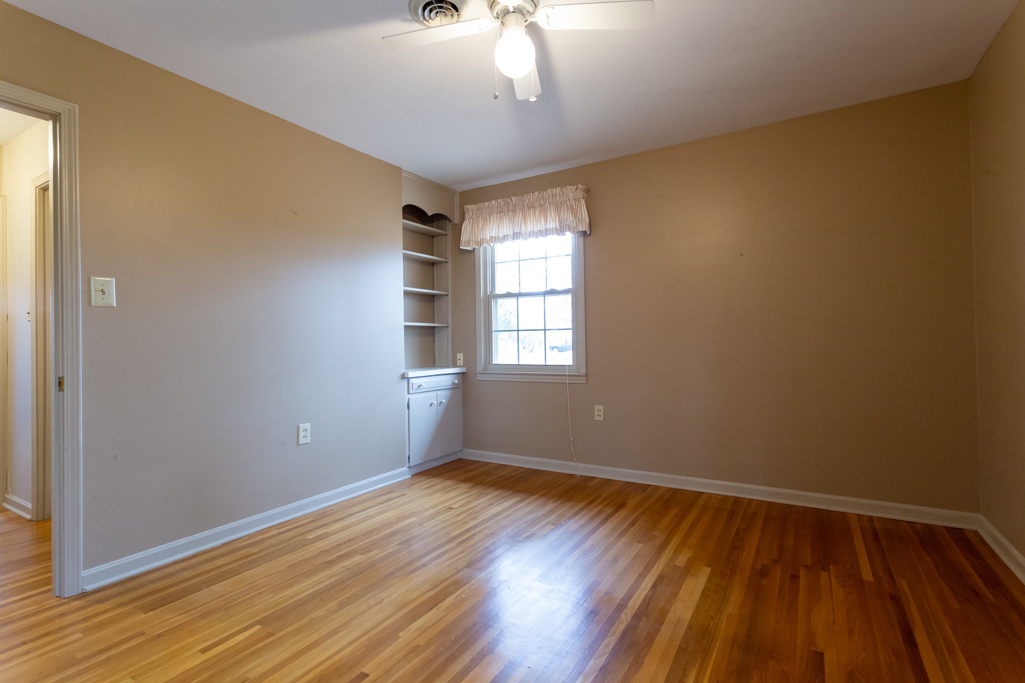 133 Byrd Road Dover, TN 37058 - Photo 10 of 35 a view of empty room with wooden floor and fan