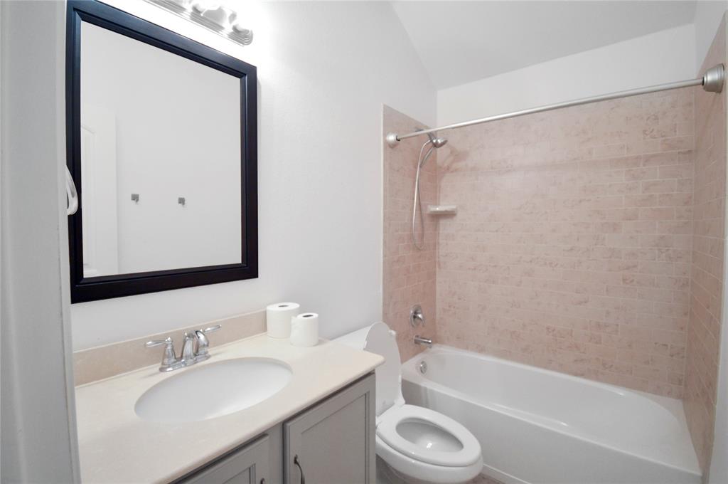 3312 Founders Way Melissa, TX 75454 - Photo 6 of 11 a bathroom with a granite countertop bathtub shower sink vanity and a mirror