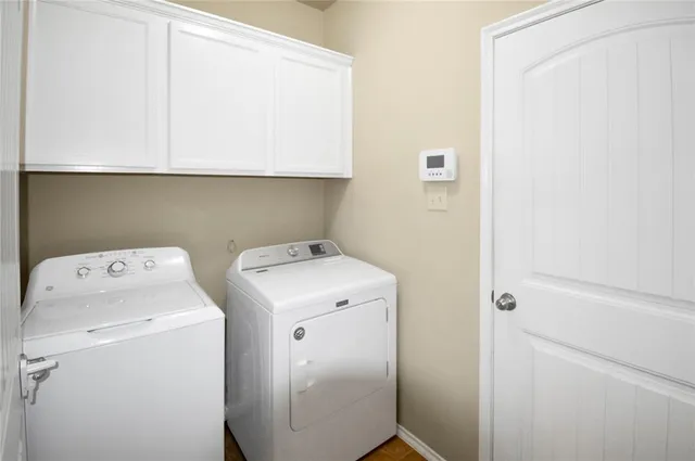 a utility room with dryer and washer