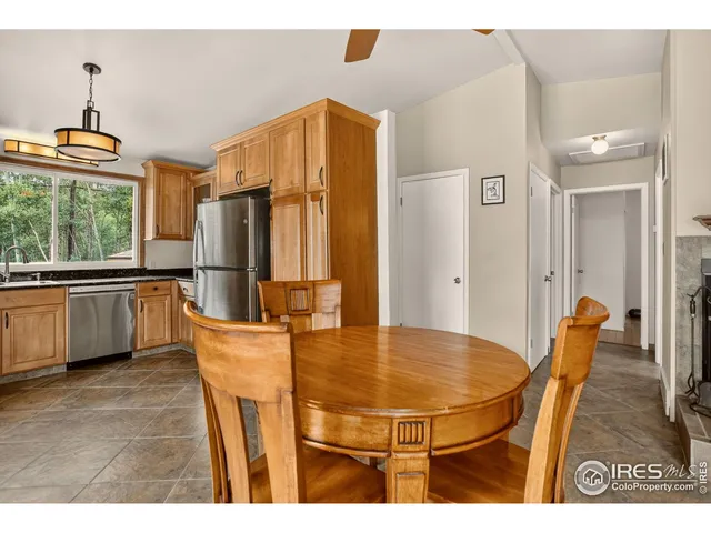 a view of a livingroom with furniture and a ceiling fan