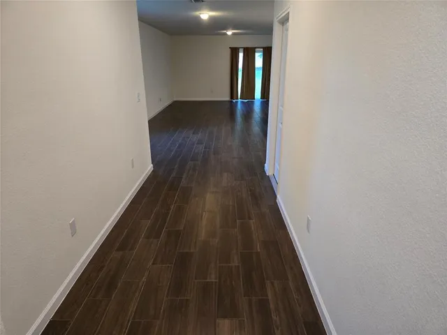 a view of entryway with wooden floor