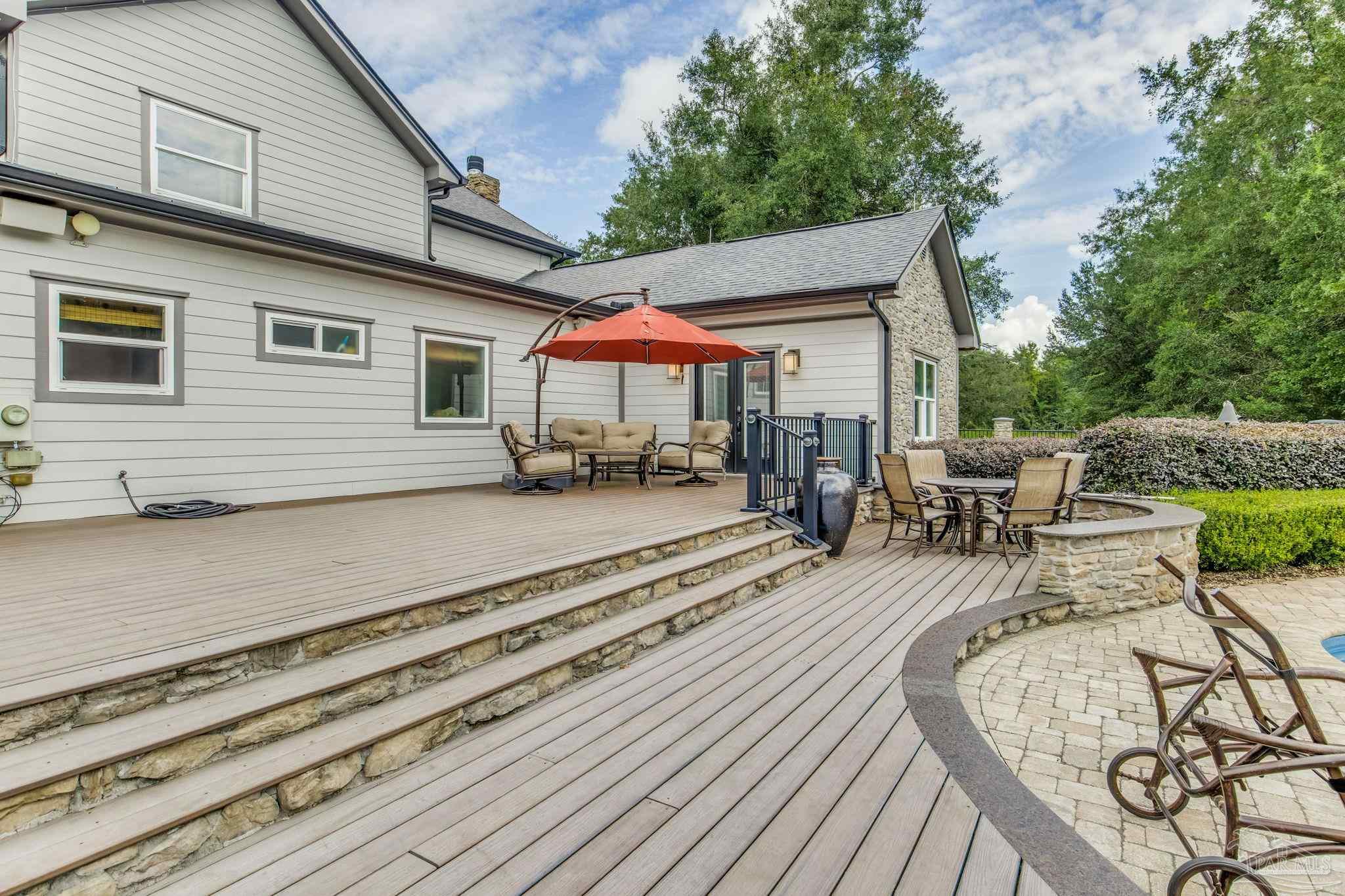 9050 Salter Road Pace, FL 32571 - Photo 31 of 66 a backyard of a house with seating space