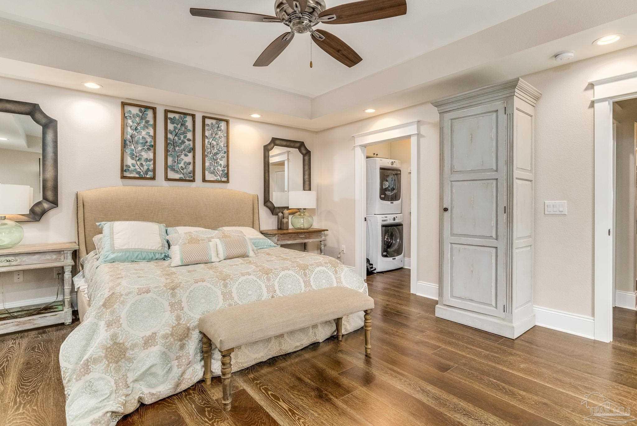 9050 Salter Road Pace, FL 32571 - Photo 45 of 66 a bedroom with a bed and a chandelier