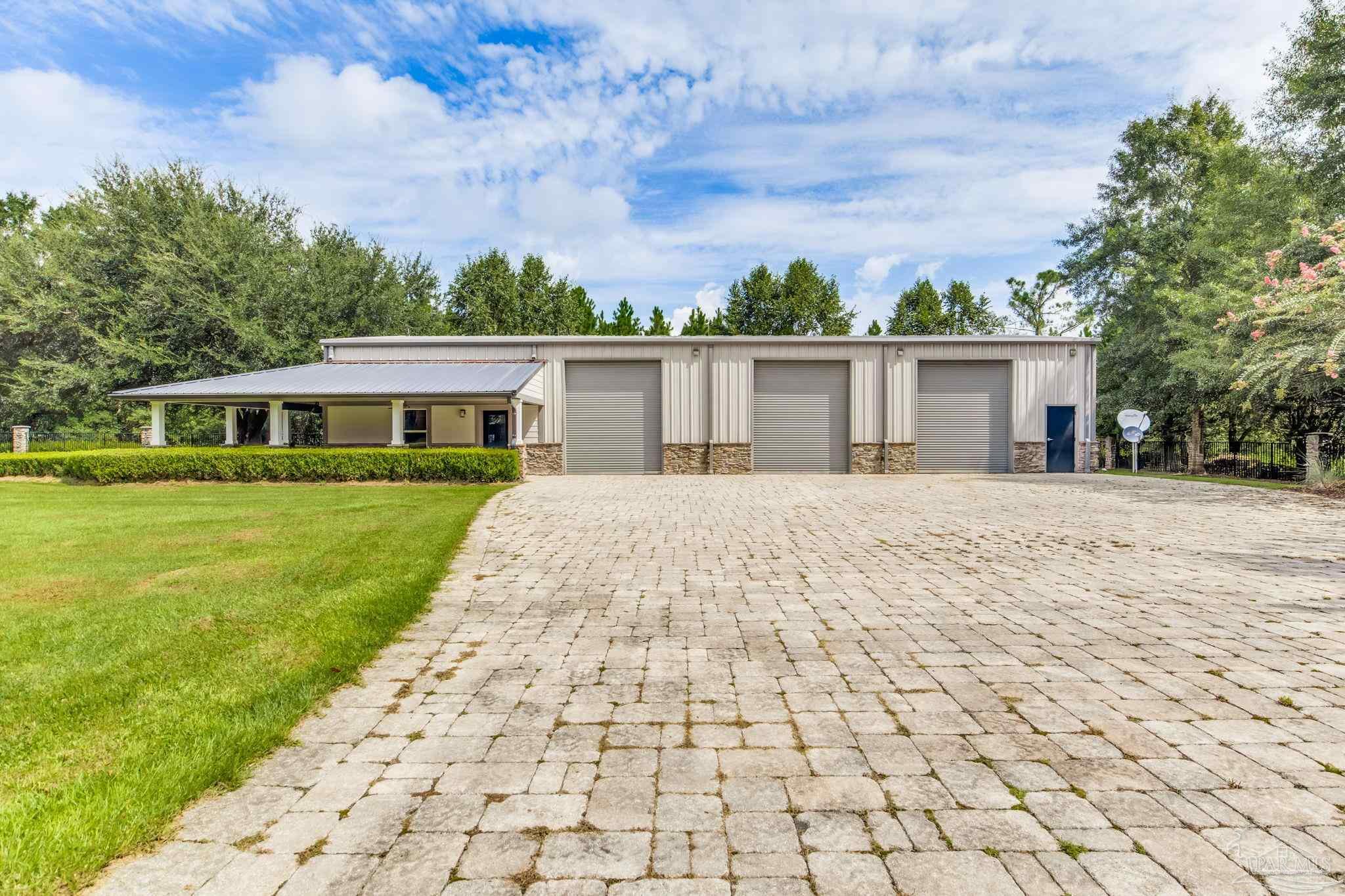 9050 Salter Road Pace, FL 32571 - Photo 52 of 66 a front view of house with yard
