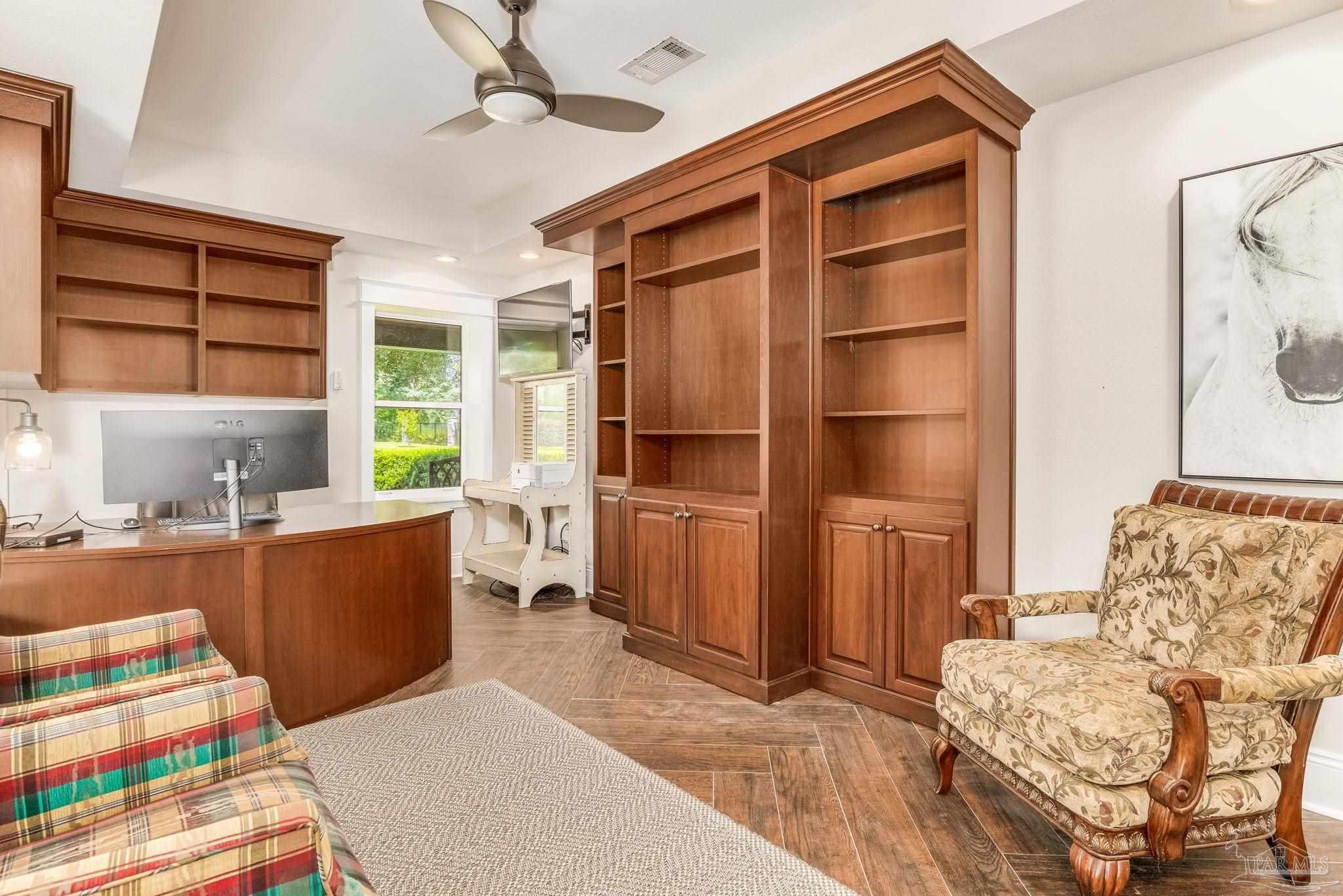 9050 Salter Road Pace, FL 32571 - Photo 54 of 66 a living room with furniture and a window