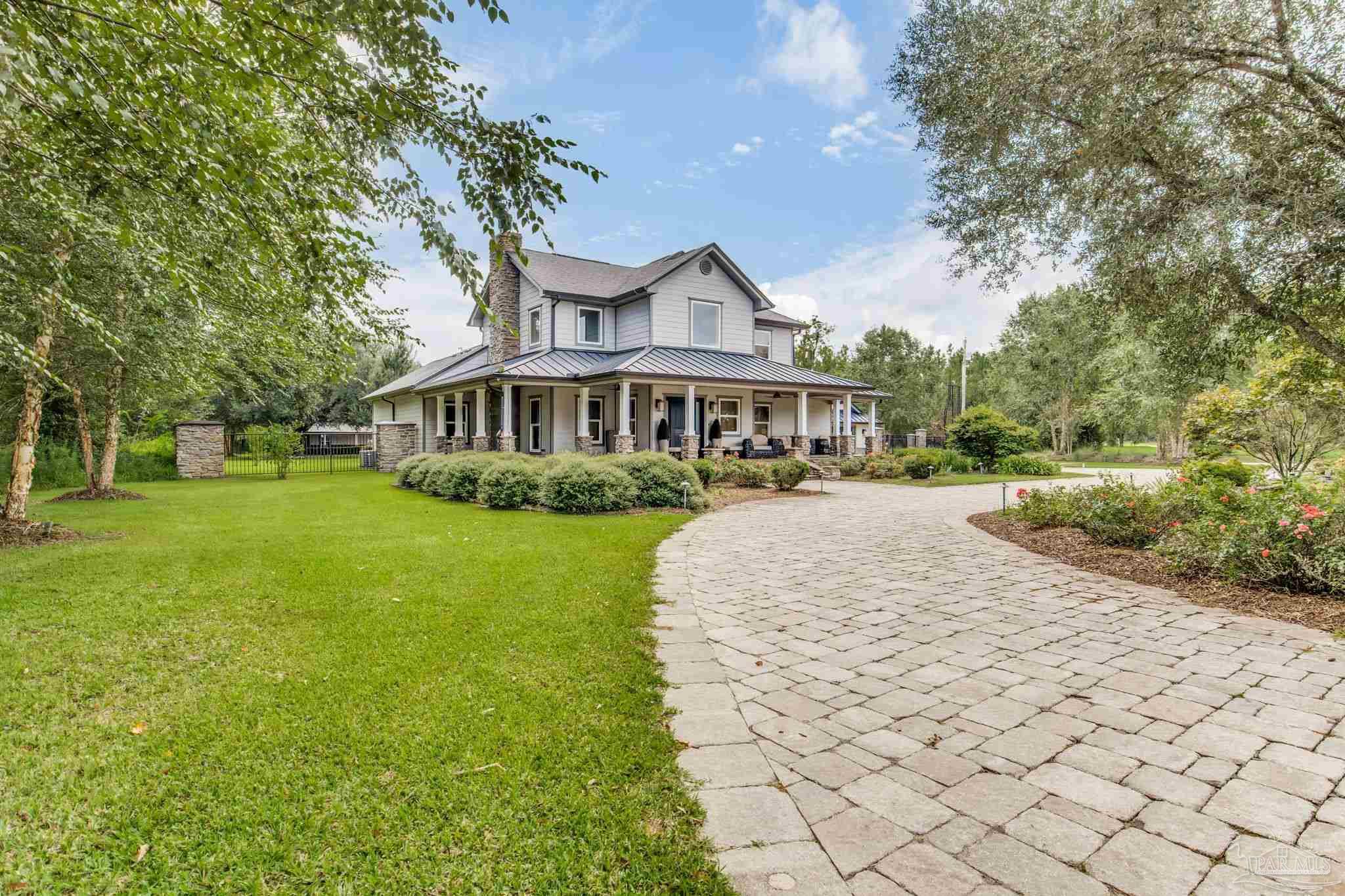 9050 Salter Road Pace, FL 32571 - Photo 6 of 66 a view of a house with a yard