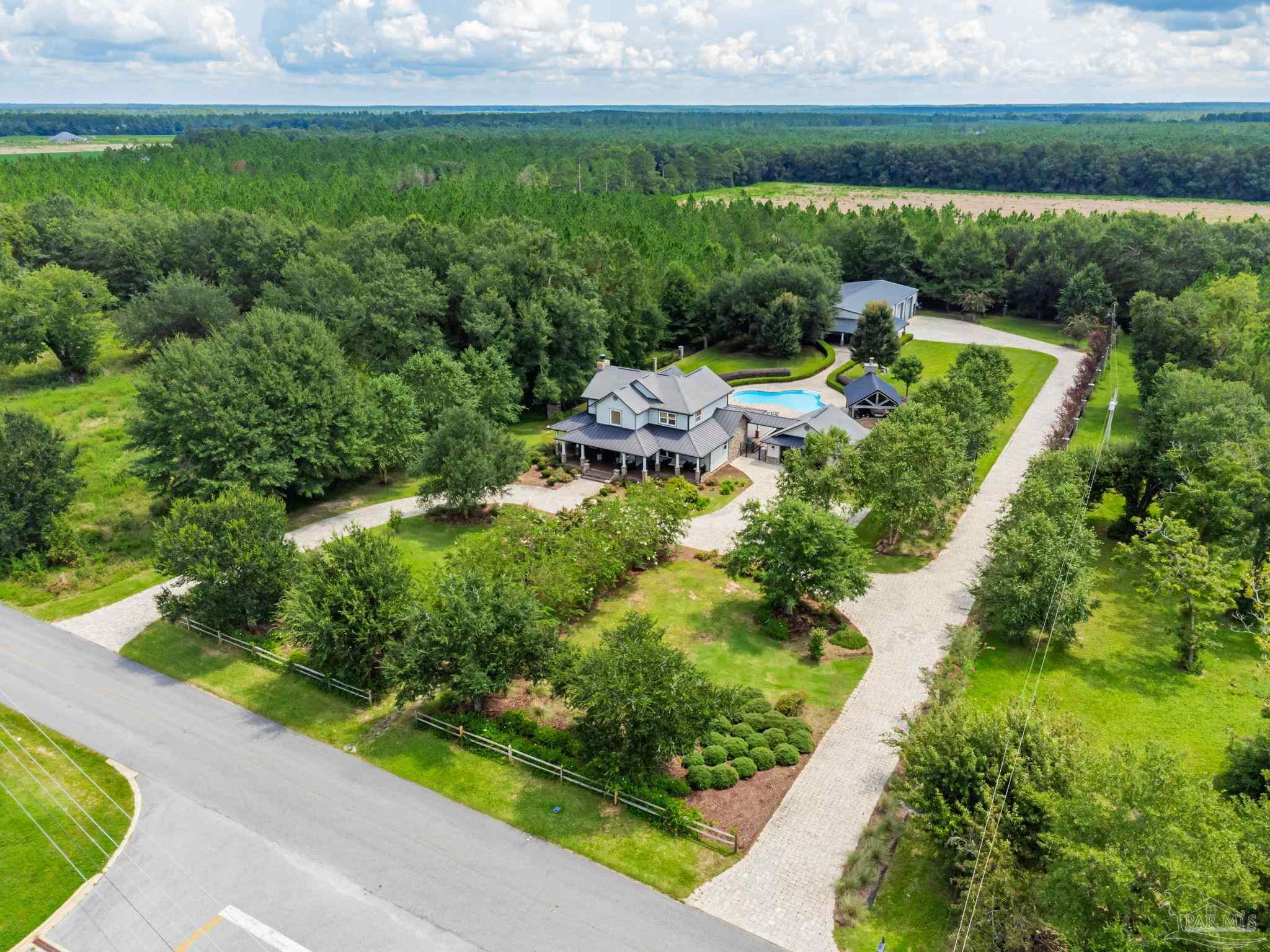 9050 Salter Road Pace, FL 32571 - Photo 66 of 66 a view of a garden with a yard