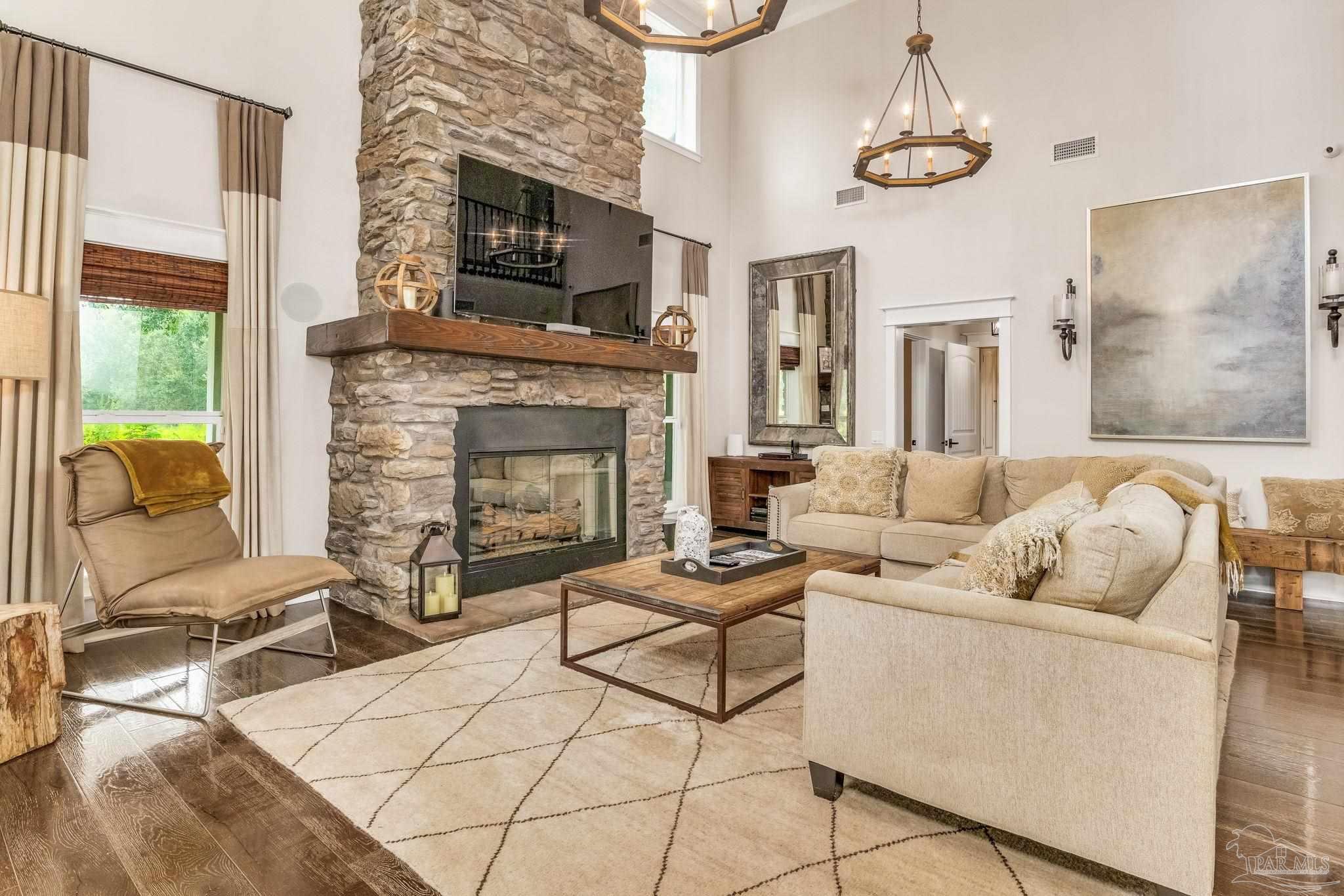 9050 Salter Road Pace, FL 32571 - Photo 9 of 66 a living room with furniture and a fireplace