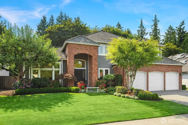 a front view of a house with a yard
