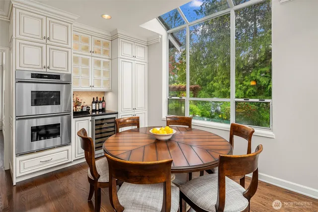 a view of a dining room with furniture window and wooden floor