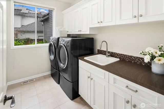 a utility room with cabinets