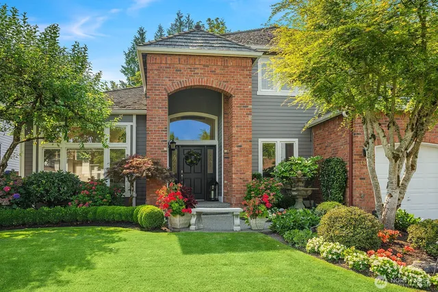 a front view of a house with garden