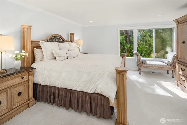 a bedroom with a large bed and a balcony view