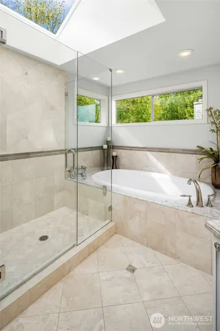 a bathroom with a bathtub and a shower