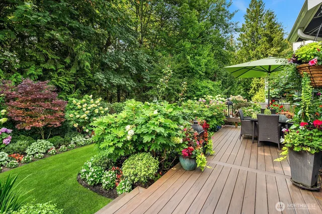 a view of a backyard with sitting area