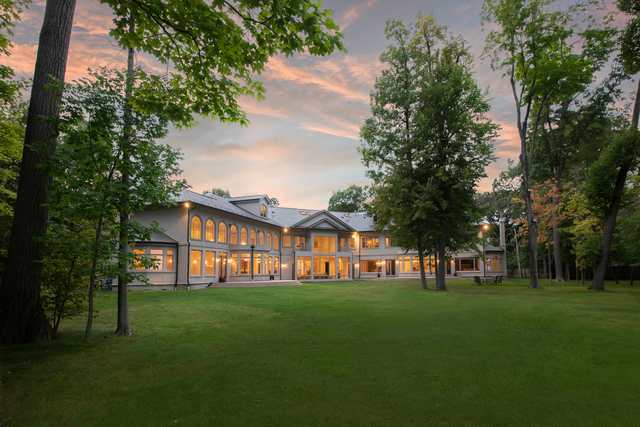 a view of house with a big yard