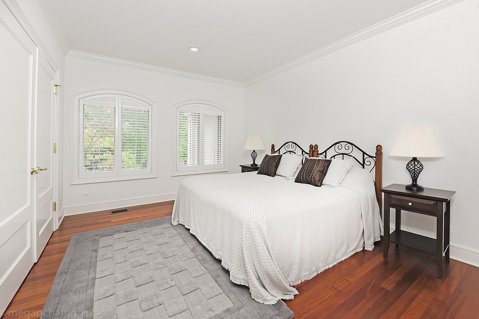 650 Arbor Drive Lake Bluff, IL 60044 - Photo 16 of 49 a bedroom with a bed and wooden floor