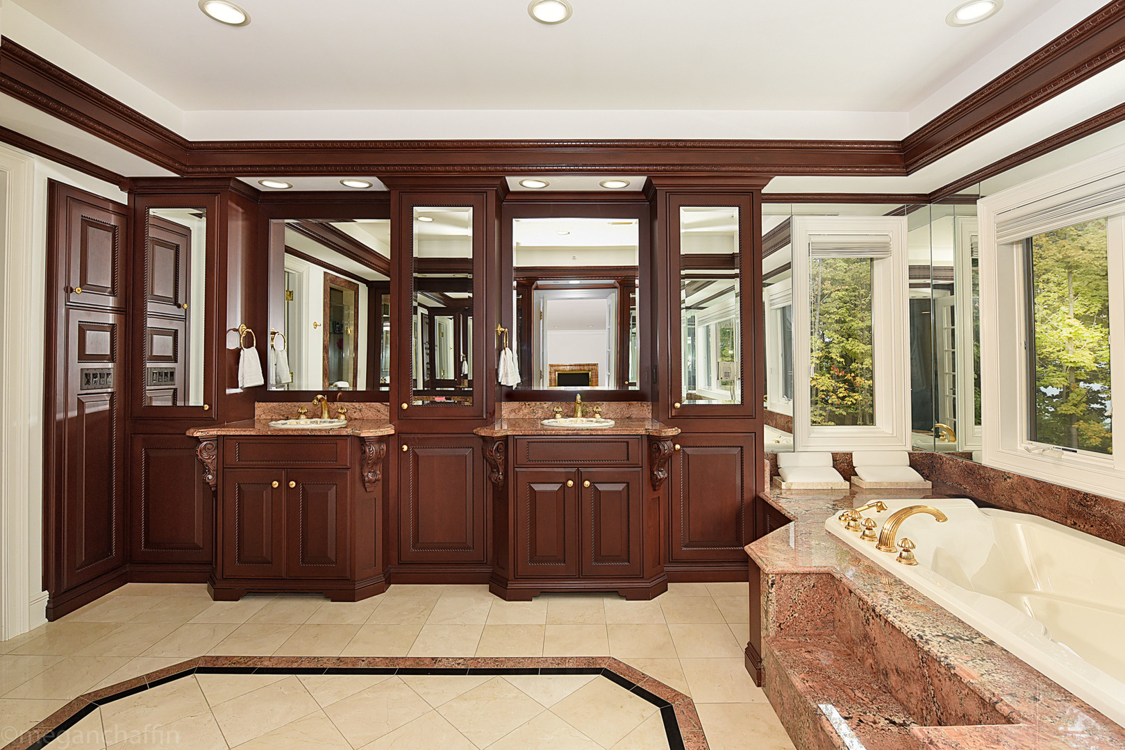 650 Arbor Drive Lake Bluff, IL 60044 - Photo 26 of 49 a bathroom with a tub a sink and large windows
