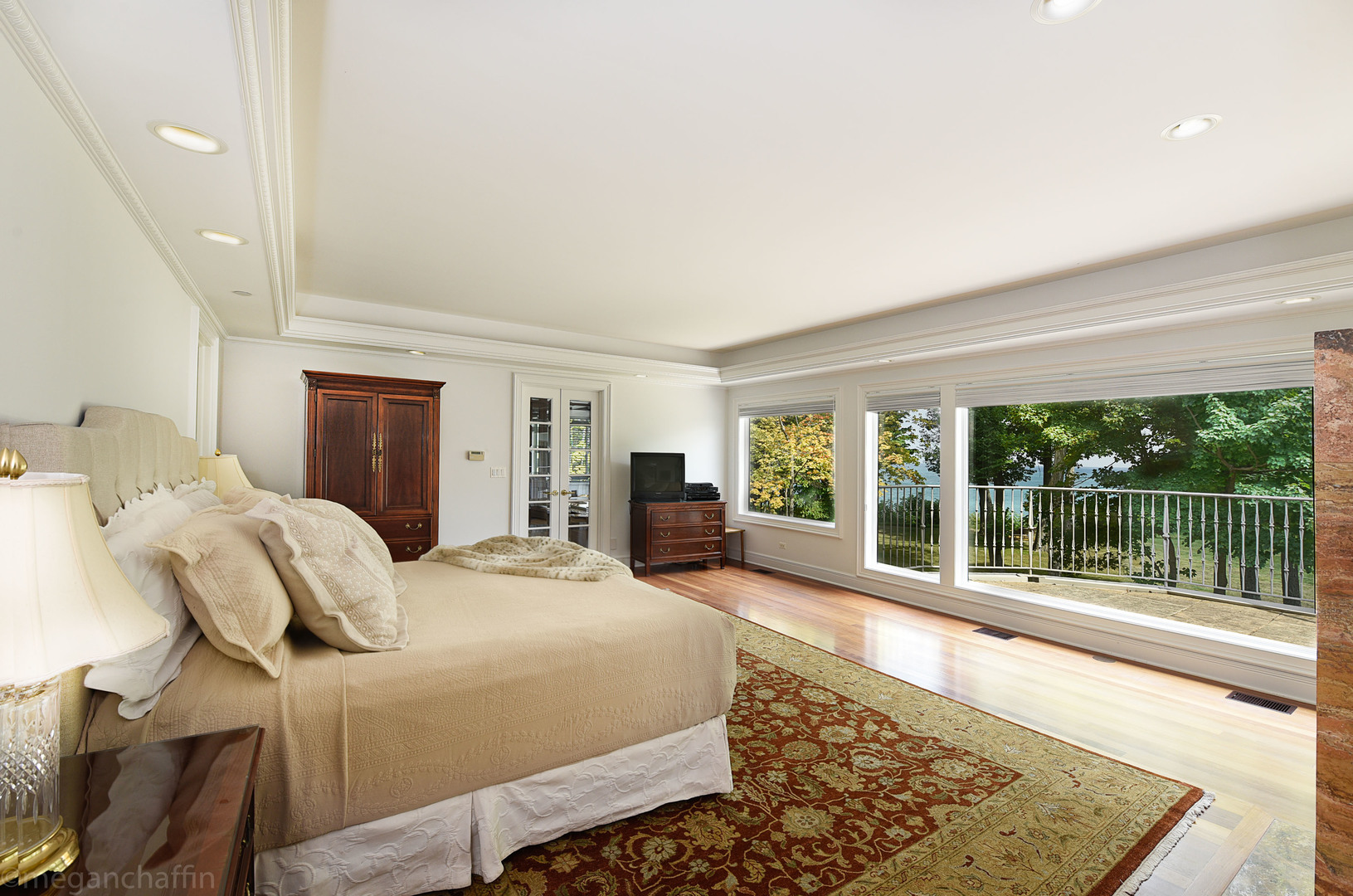 650 Arbor Drive Lake Bluff, IL 60044 - Photo 28 of 49 a large bedroom with a bed and glass window