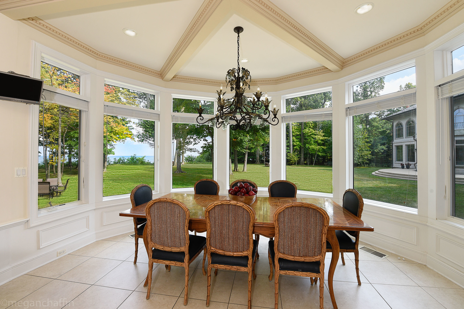 650 Arbor Drive Lake Bluff, IL 60044 - Photo 34 of 49 a view of a dining room with furniture large windows and wooden floor