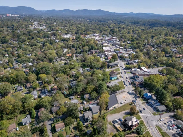 an aerial view of a city and mountain view in back