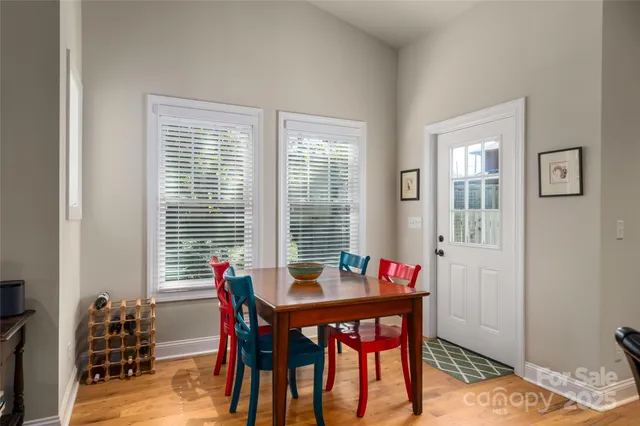 a view of a dining room with furniture and window