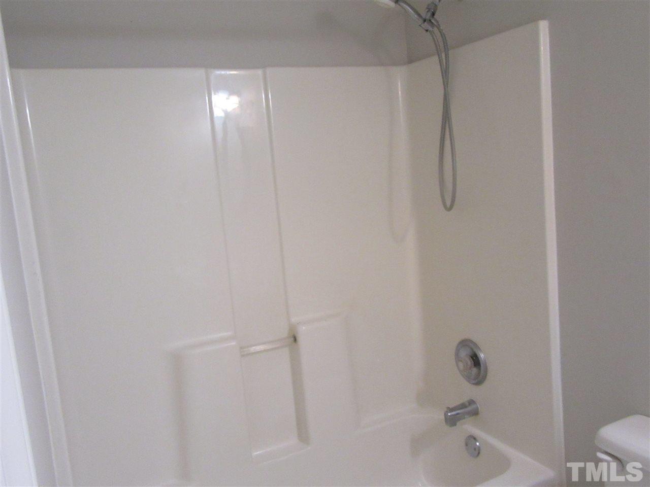 5113 Silverdene Street Raleigh, NC 27616 - Photo 16 of 25 a bathroom with a bathtub