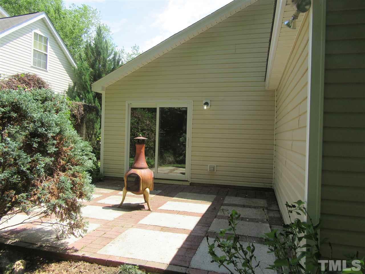 5113 Silverdene Street Raleigh, NC 27616 - Photo 22 of 25 a small garden in the backyard of a house