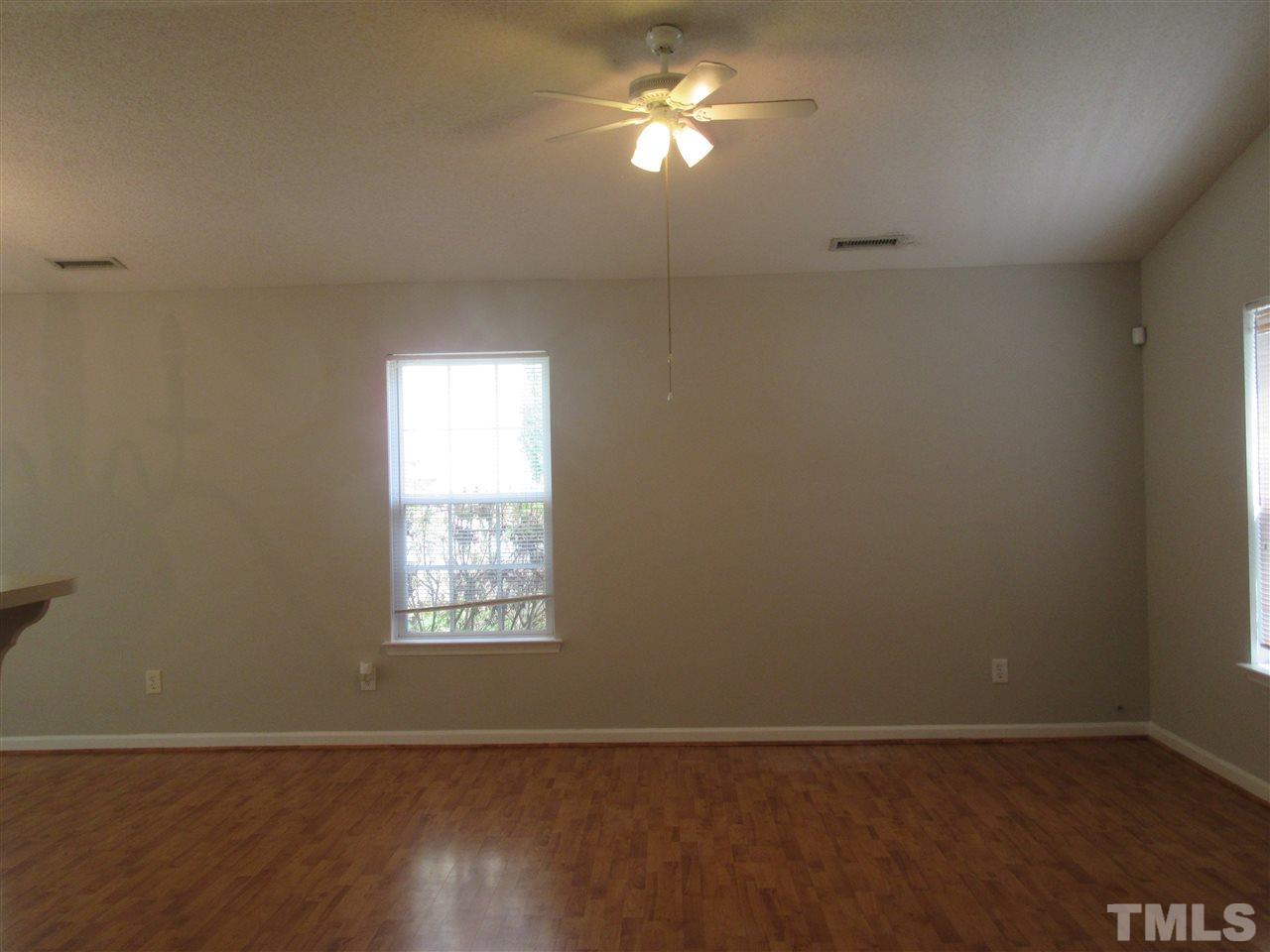 5113 Silverdene Street Raleigh, NC 27616 - Photo 10 of 25 a view of an empty room with a window