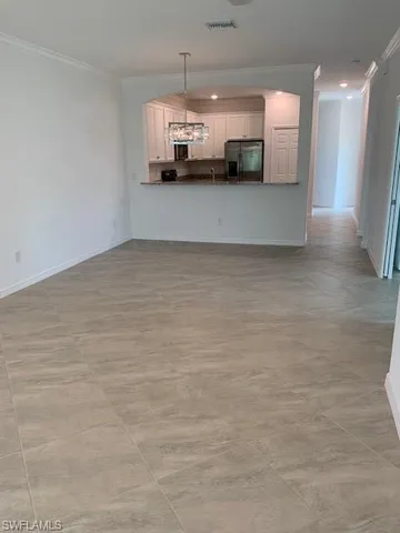 a view of a refrigerator in a kitchen