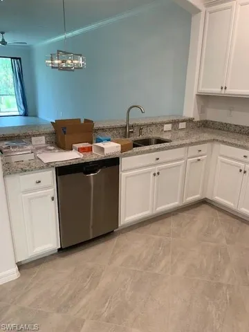 a kitchen with a sink and cabinets