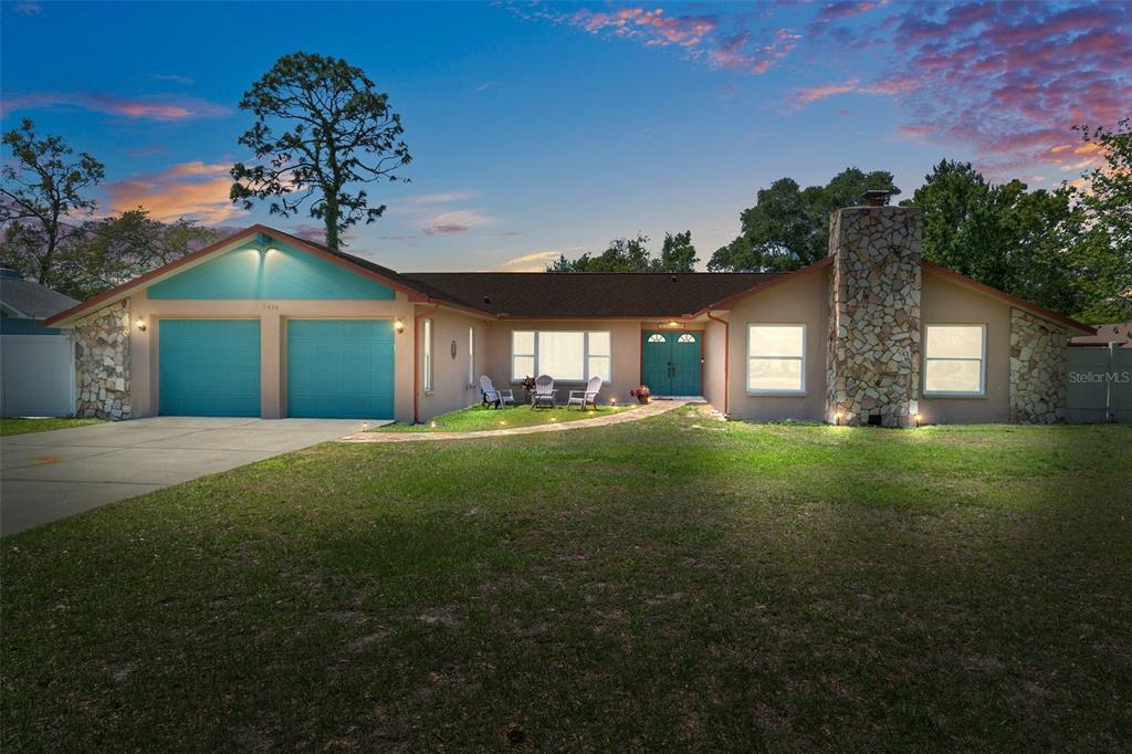 9436 Horizon Drive Spring Hill, FL 34608 - Photo 1 of 1 a front view of a house with garden