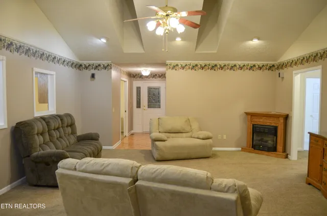 a living room with furniture and a table