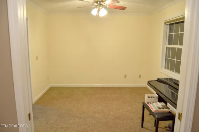 a view of a room with a table and a chair