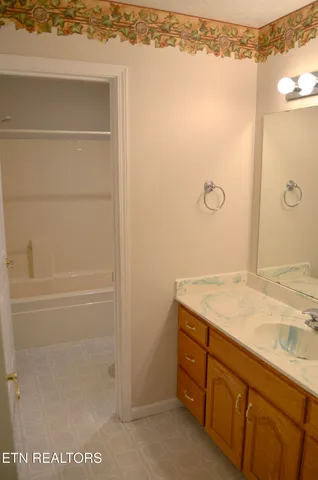 a bathroom with a granite countertop