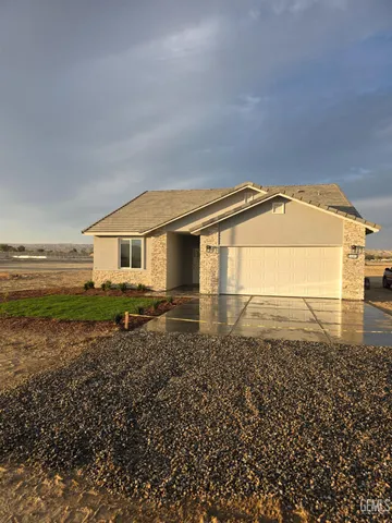 an outdoor view of house with backyard